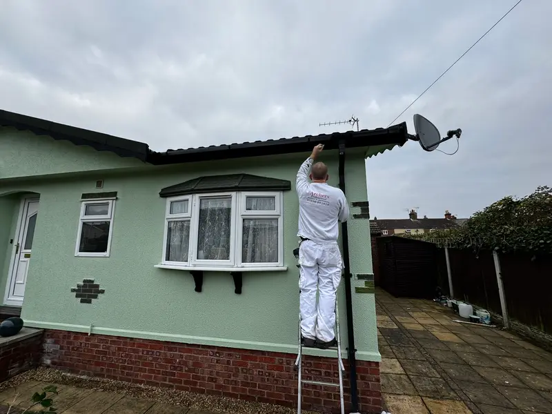 Archers decorator repainting a home exterior
