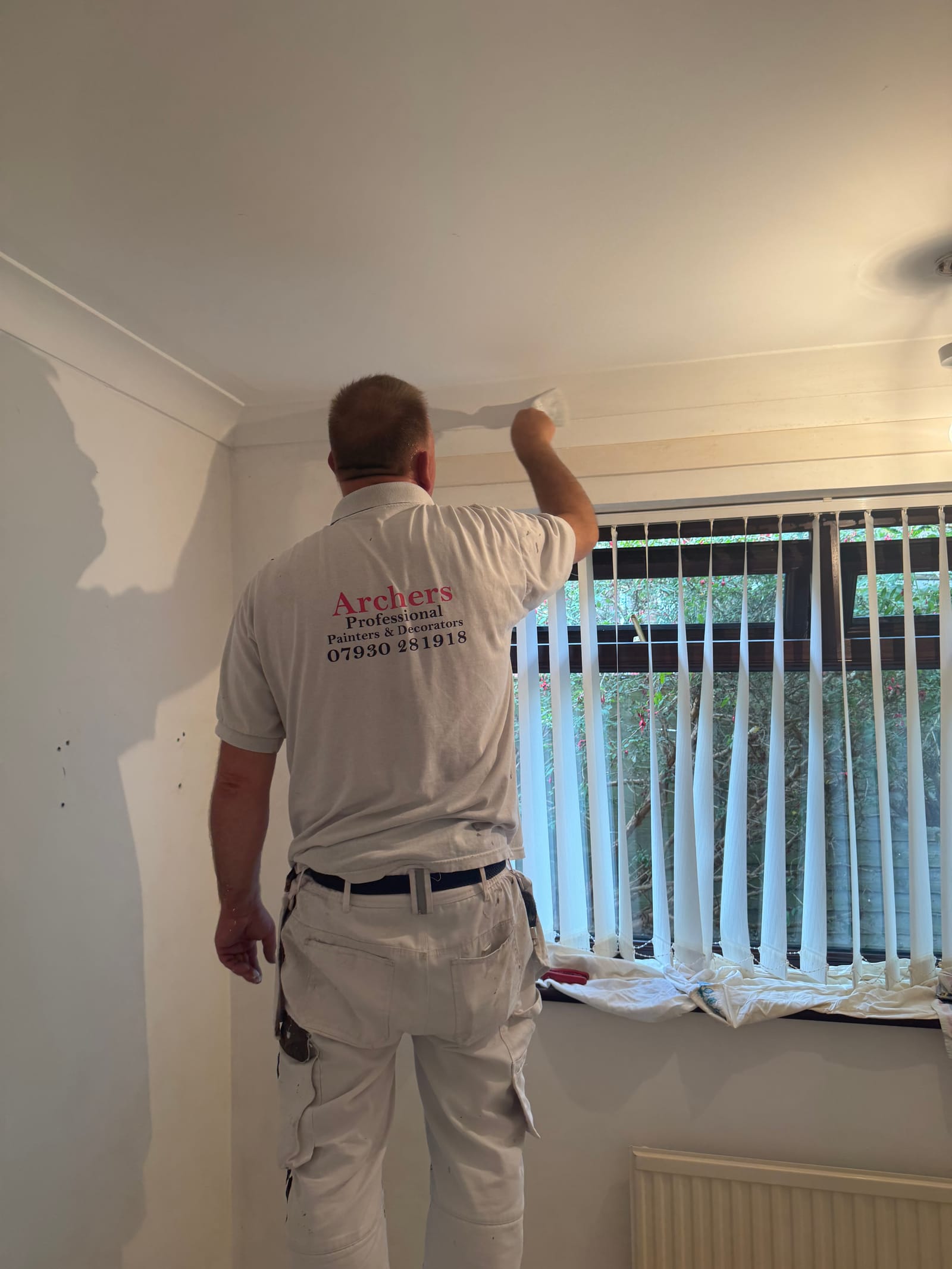 Archers decorator hand-finishing a wall by brush